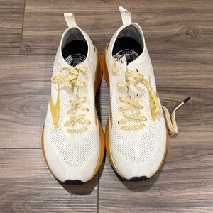 Brooks White Knit Sneakers with gold Accents